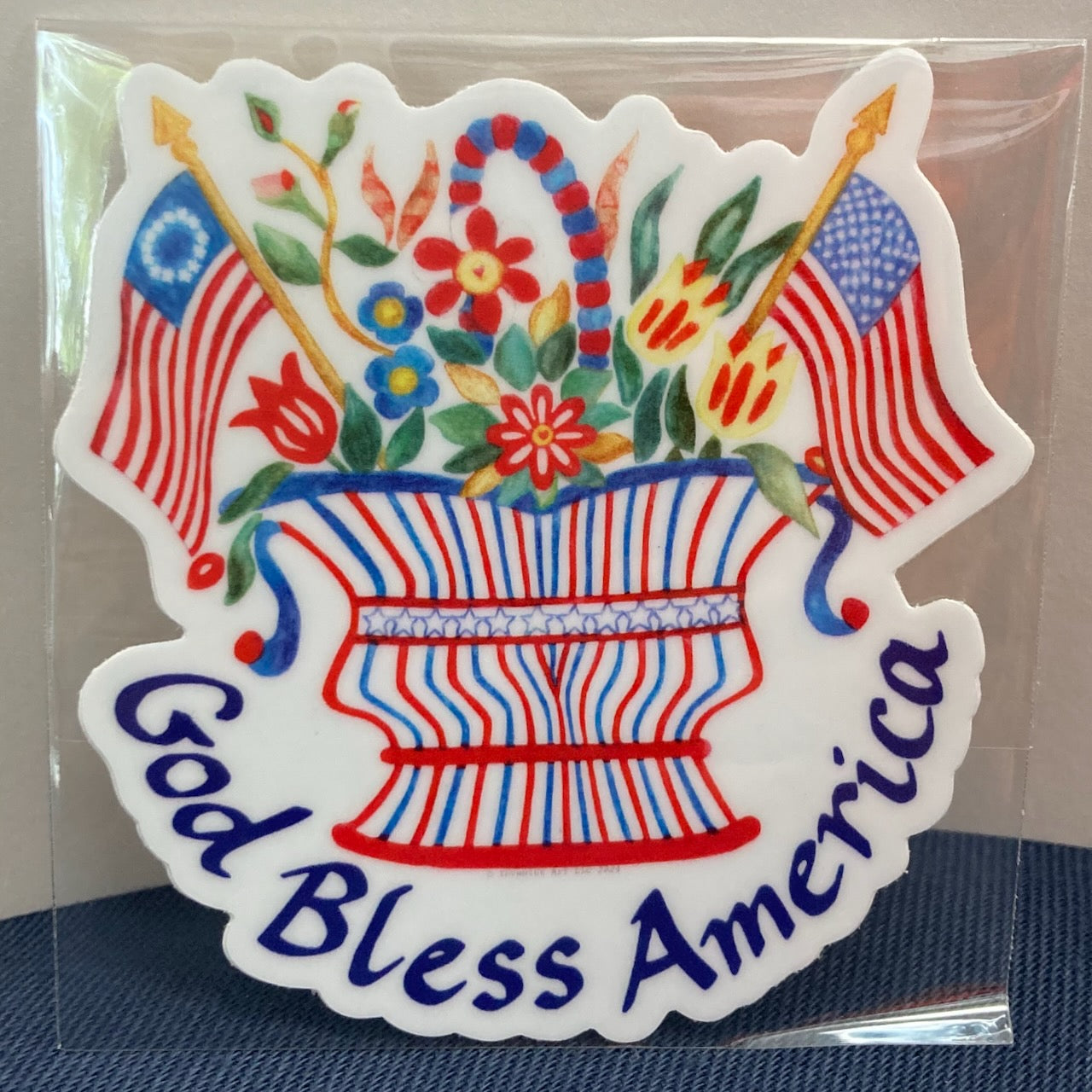 "God Bless America" Flags and Flowers Basket Vinyl Sticker (2.81″ × 3″)