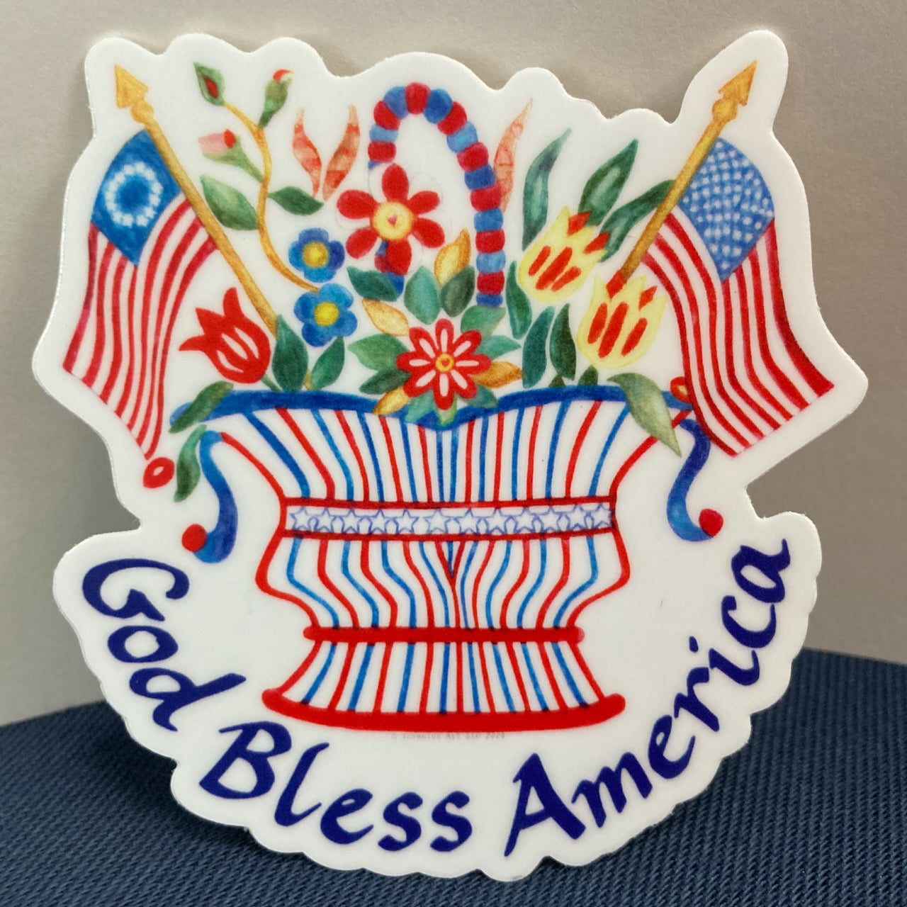 "God Bless America" Flags and Flowers Basket Vinyl Sticker (2.81″ × 3″)